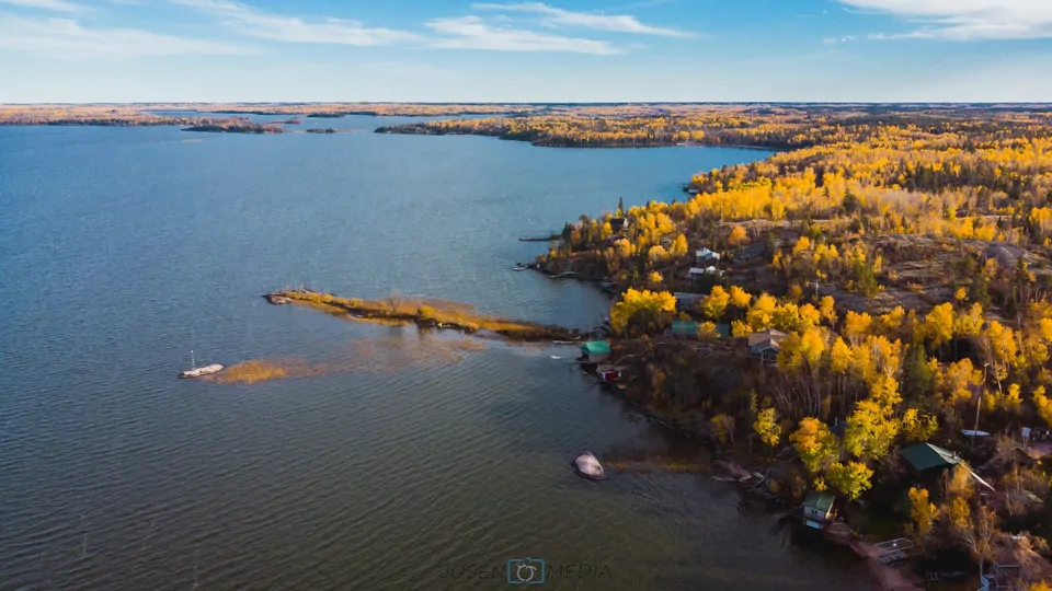 Manitoba-fall View of water and trees in fall in Manitoba
