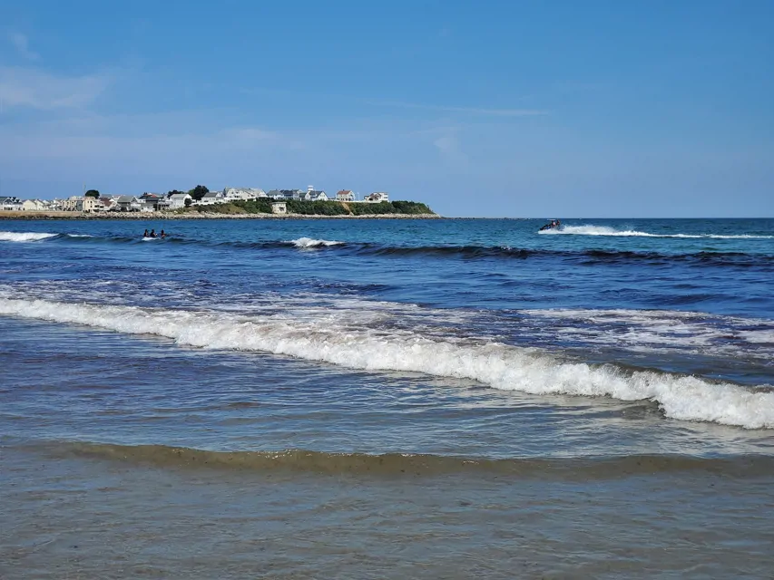 A boat crusing on the ocean at Hampton Beach State Park