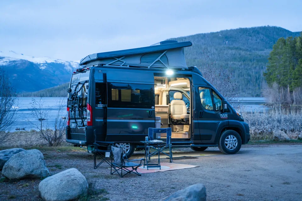 Pop-top campervan at twilight
