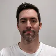 NICOLAS B.