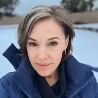 Rhea M.