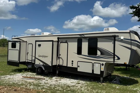 Camp with Comfort  Forest River Sandpiper 384QB0K Fifth Wheel