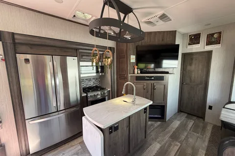 Camp with Comfort  Forest River Sandpiper 384QB0K Fifth Wheel
