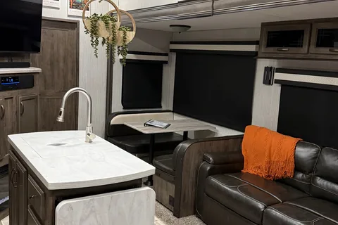 Camp with Comfort  Forest River Sandpiper 384QB0K Fifth Wheel