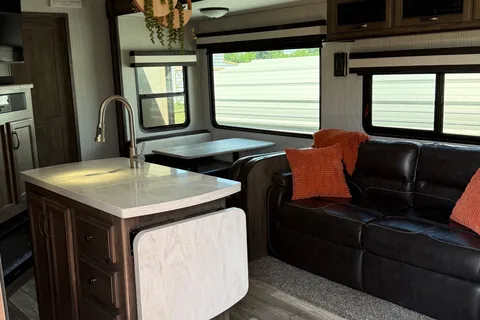 Camp with Comfort  Forest River Sandpiper 384QB0K Fifth Wheel