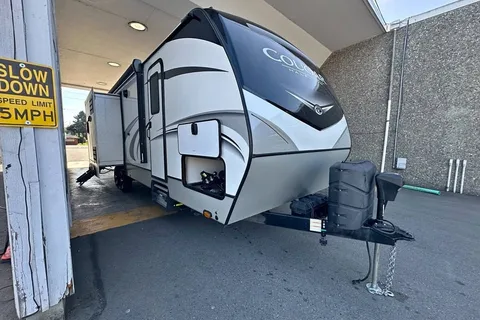 Half ton and family friendly Keystone Cougar 31 BHKWE Travel Trailer