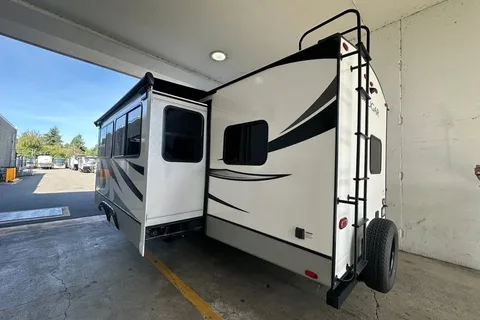 Half ton and family friendly Keystone Cougar 31 BHKWE Travel Trailer