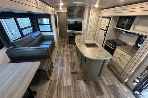 Half ton and family friendly Keystone Cougar 31 BHKWE Travel Trailer