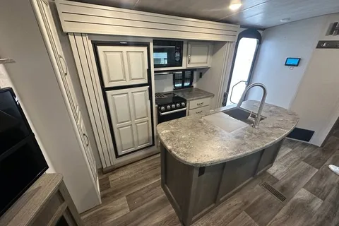 Half ton and family friendly Keystone Cougar 31 BHKWE Travel Trailer