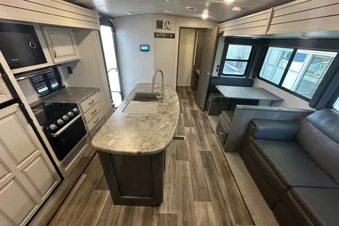 Half ton and family friendly Keystone Cougar 31 BHKWE Travel Trailer