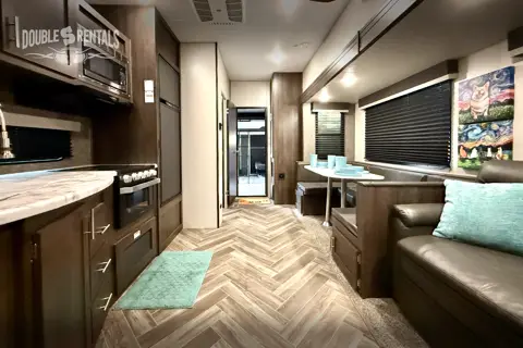 SPORTSTER Toy Hauler with 2 Queen Beds, U-Shaped Dinette & Sofa