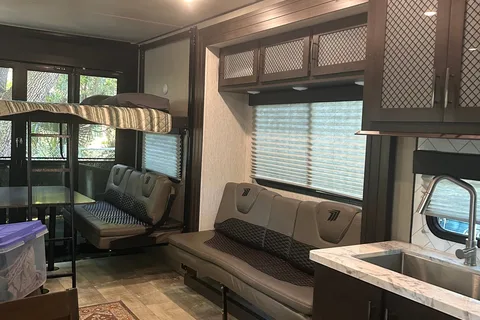 Moira's Mansion 2022 Grand Design Momentum Toy Hauler