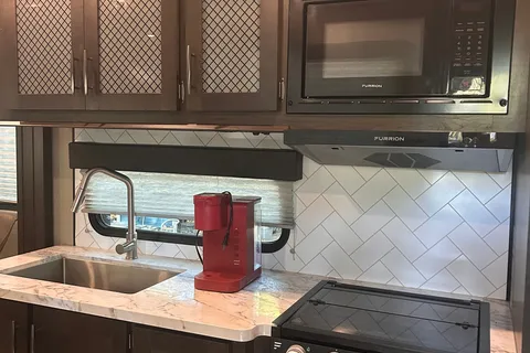 Moira's Mansion 2022 Grand Design Momentum Toy Hauler