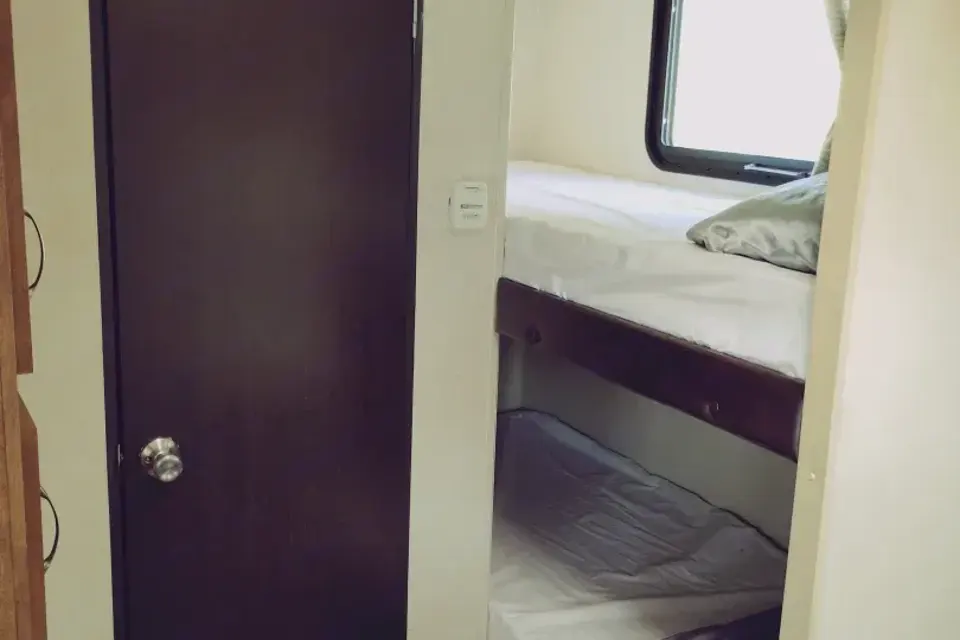 Meet Judy, our lightweight, retro themed little camper with bunkbeds to sleep five!