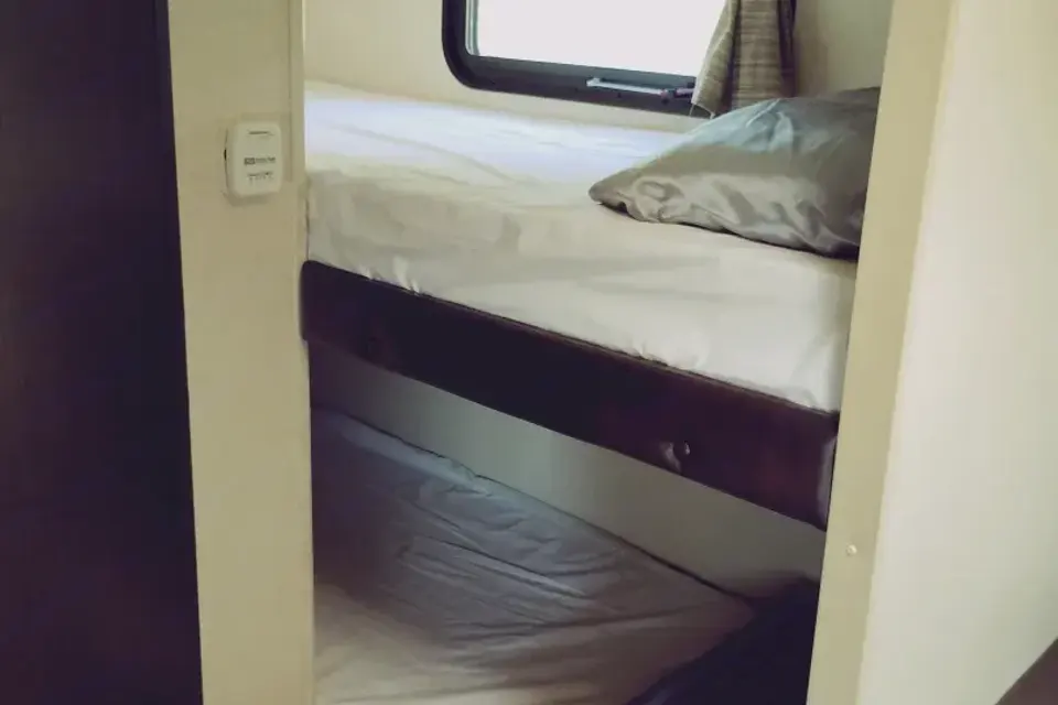 Meet Judy, our lightweight, retro themed little camper with bunkbeds to sleep five!