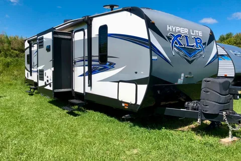 Spacious Toy Hauler Trailer: Queen Beds, Massage Sofa, A/C & More!