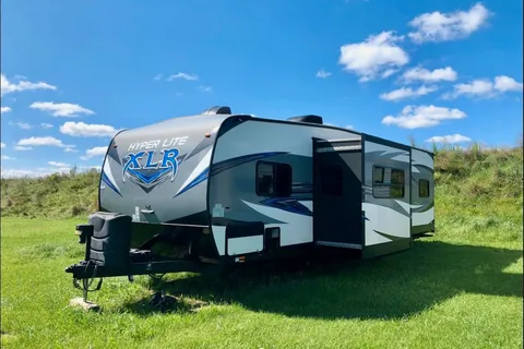 Spacious Toy Hauler Trailer: Queen Beds, Massage Sofa, A/C & More!