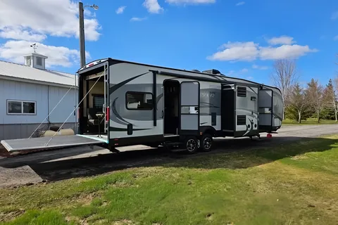 Spacious Toy Hauler Trailer: Queen Beds, Massage Sofa, A/C & More!