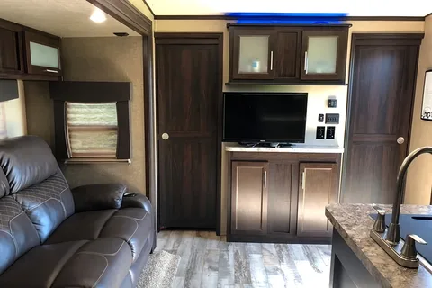 Spacious Toy Hauler Trailer: Queen Beds, Massage Sofa, A/C & More!