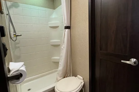 Spacious Toy Hauler Trailer: Queen Beds, Massage Sofa, A/C & More!
