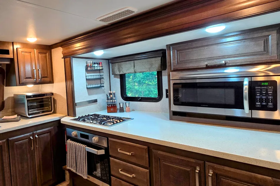 Treelined RV Stay Near Boyne — Fire Pit, S'mores, Dogs Welcome