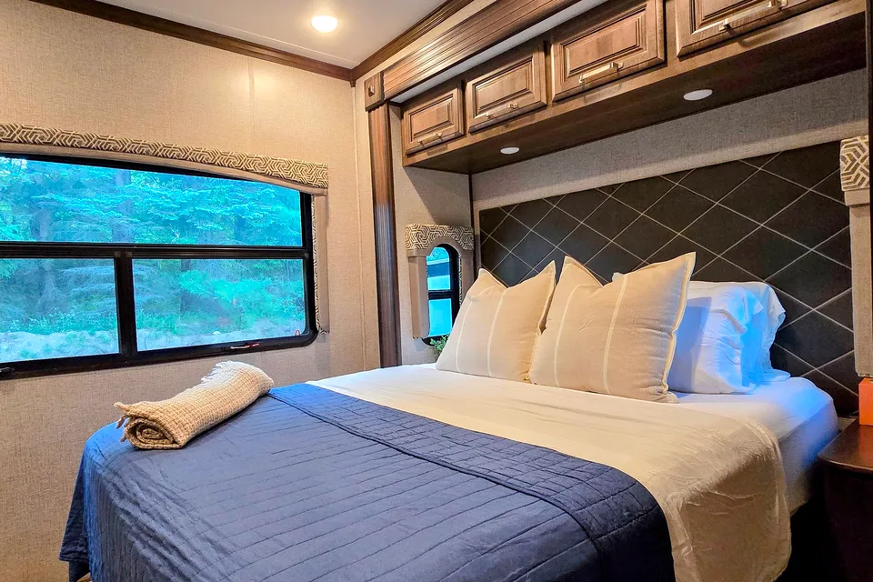 Treelined RV Stay Near Boyne — Fire Pit, S'mores, Dogs Welcome
