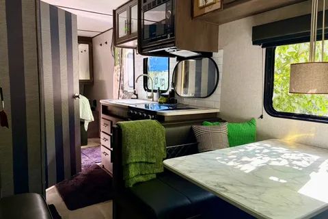 Coleman Lantern 202RDWE Travel Trailer  named “TOWBIE”