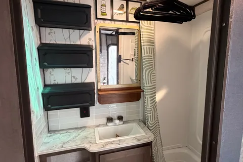 Coleman Lantern 202RDWE Travel Trailer  named “TOWBIE”