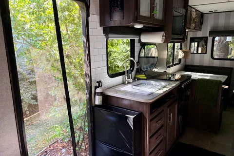 Coleman Lantern 202RDWE Travel Trailer  named “TOWBIE”