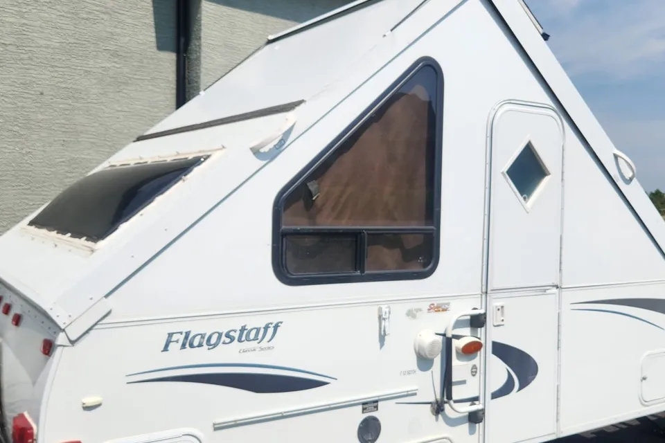 Musesica Forest River Flagstaff 12SDTH toy hauler A Frame Travel Trailer