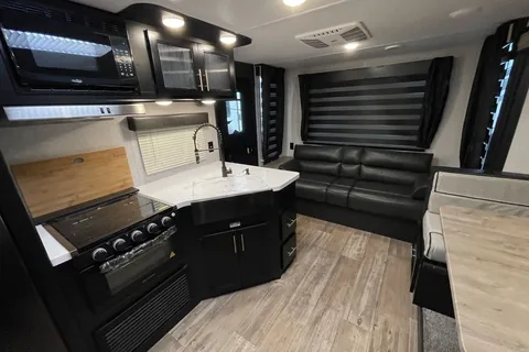 “Monique” - New 2022 Forest River Grey Wolf 23 MKBL Black Label