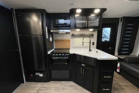 “Monique” - New 2022 Forest River Grey Wolf 23 MKBL Black Label