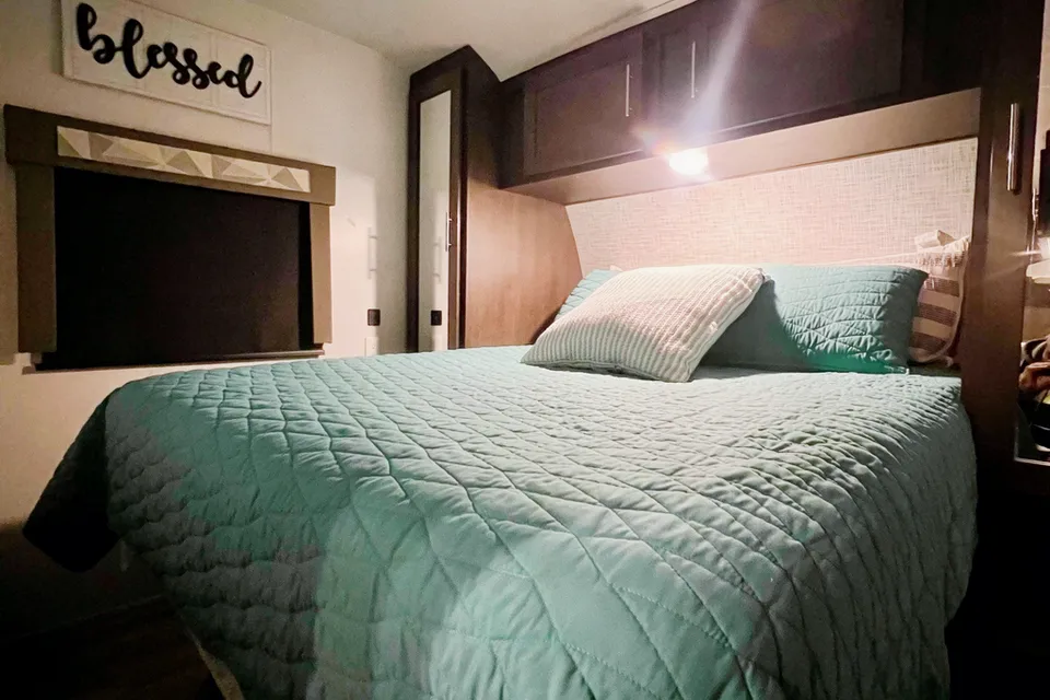 "Little home on wheels" 2020 WILDWOOD with master bedroom and bunks at the rear.