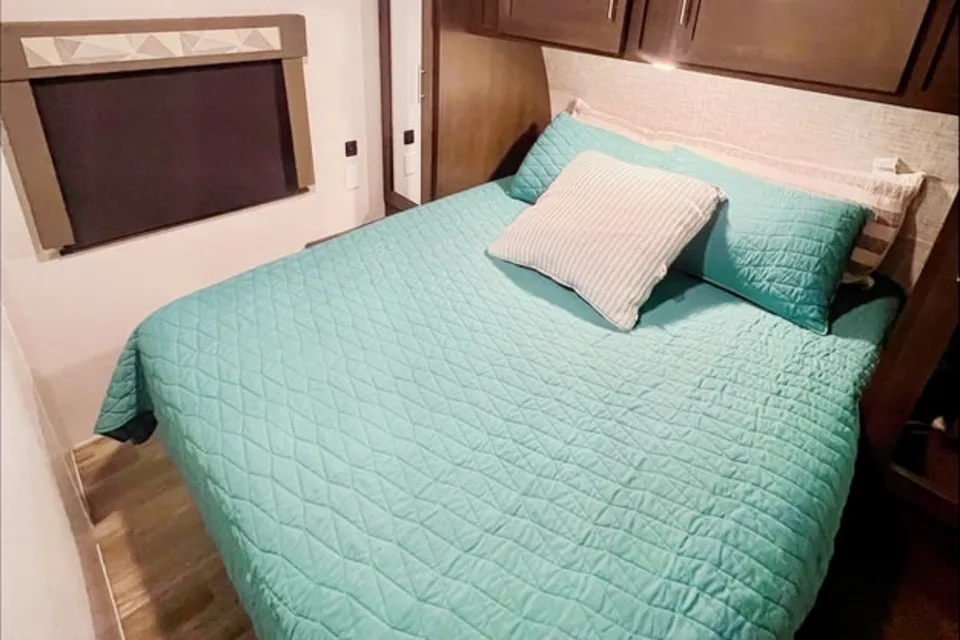 "Little home on wheels" 2020 WILDWOOD with master bedroom and bunks at the rear.
