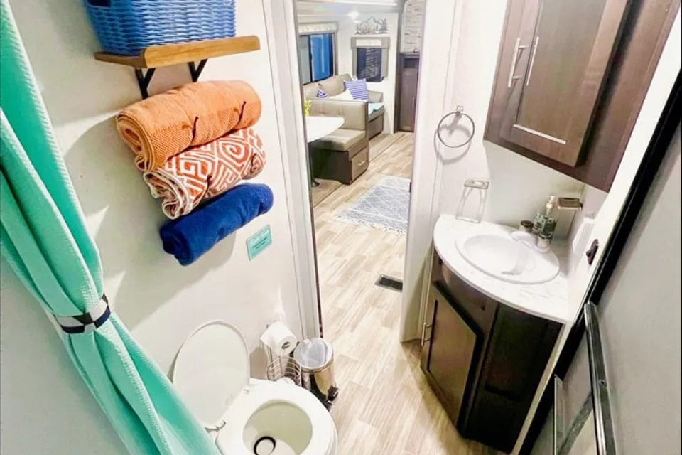 "Little home on wheels" 2020 WILDWOOD with master bedroom and bunks at the rear.