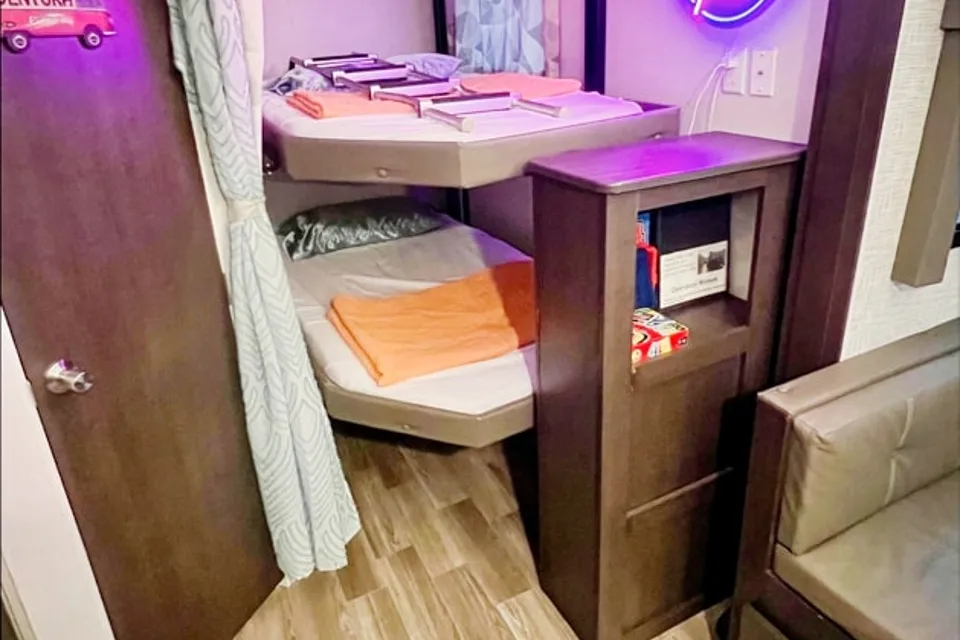 "Little home on wheels" 2020 WILDWOOD with master bedroom and bunks at the rear.