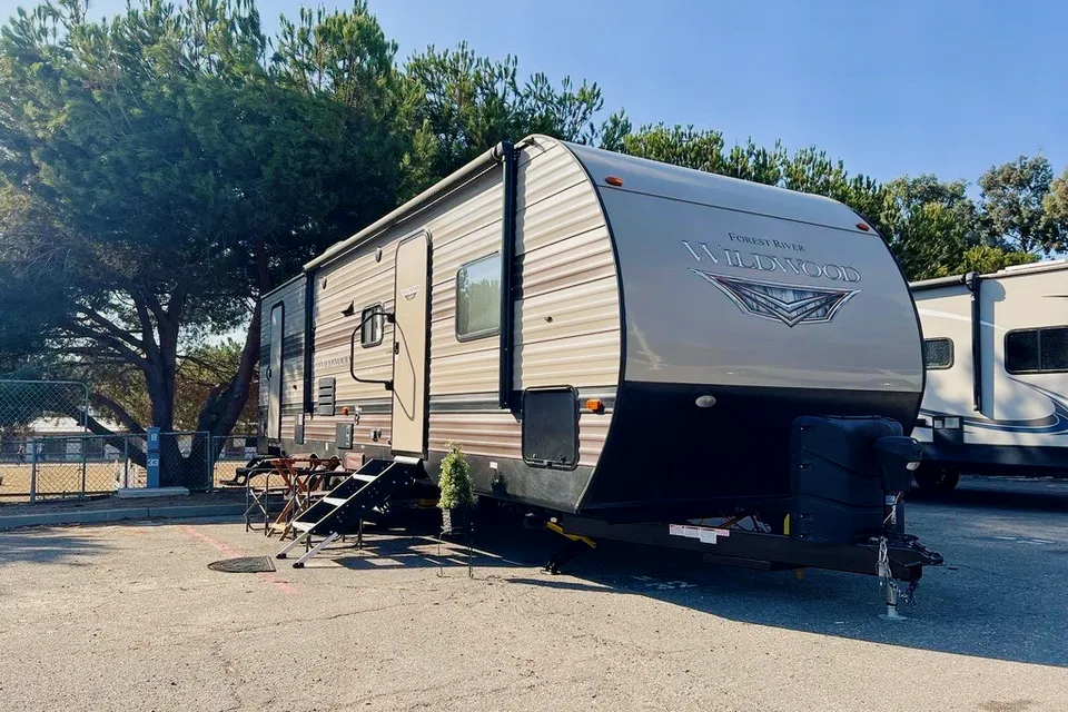"Little home on wheels" 2020 WILDWOOD with master bedroom and bunks at the rear.