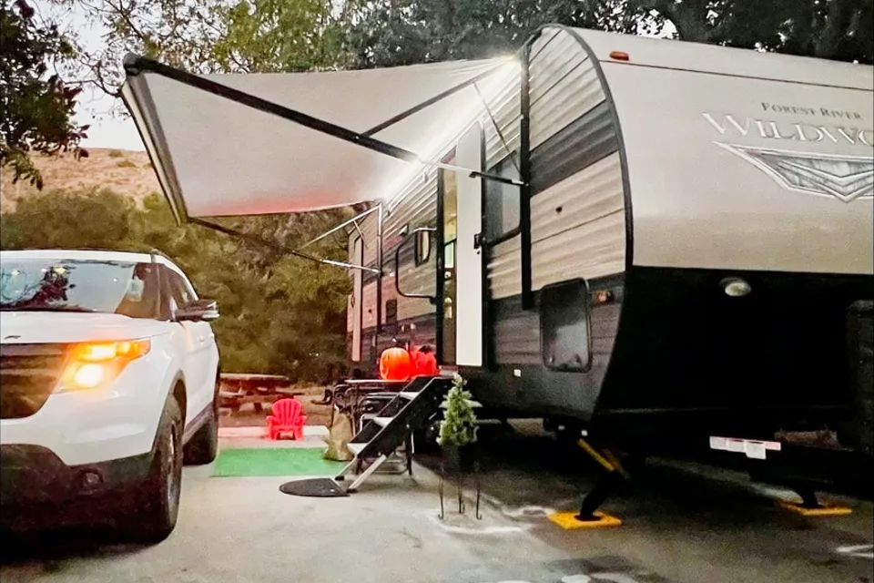 "Little home on wheels" 2020 WILDWOOD with master bedroom and bunks at the rear.