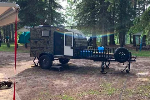 Camo Sunset Park RV Sunray Micro Trailer with toy hauler on front