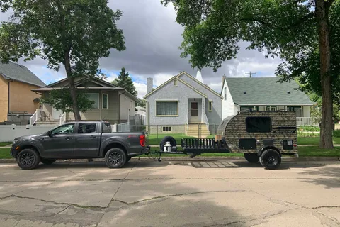 Camo Sunset Park RV Sunray Micro Trailer with toy hauler on front