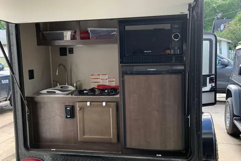 Camo Sunset Park RV Sunray Micro Trailer with toy hauler on front