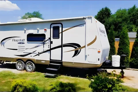 Jessica's 25’ Flagstaff  Trailer with large slide and bunk