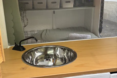 Spacious Square-Drop trailer with a small kitchen