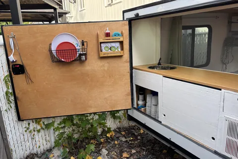 Spacious Square-Drop trailer with a small kitchen