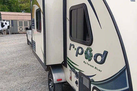 Earl 's Forest River  R POD Micro Trailer with Slider for more room.