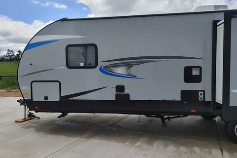 Matt and Shannon Forest River Alpha Wolf 26RL-L Travel Trailer