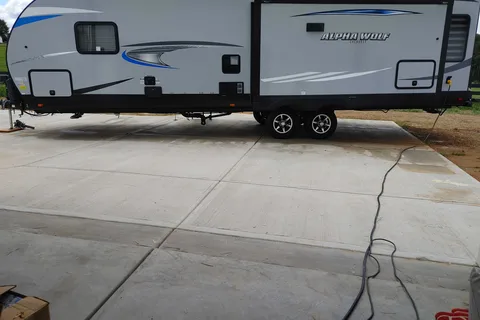 Matt and Shannon Forest River Alpha Wolf 26RL-L Travel Trailer