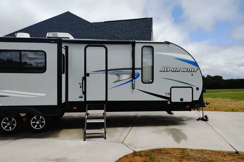 Matt and Shannon Forest River Alpha Wolf 26RL-L Travel Trailer