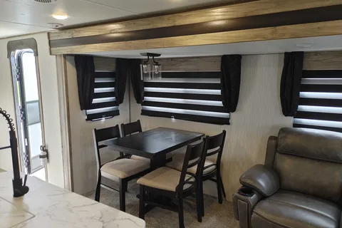 Matt and Shannon Forest River Alpha Wolf 26RL-L Travel Trailer