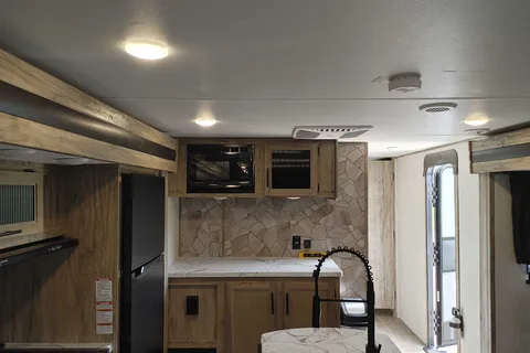 Matt and Shannon Forest River Alpha Wolf 26RL-L Travel Trailer